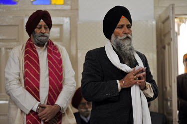 The father of the groom and the ceremony priest at the wedding of British/Punjabi couple Lindsay and Navneet Singh.