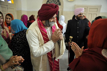The father of the groom at the wedding ceremony of British/Punjabi couple Lindsay and Navneet Singh at a gurdwara in Amritsar.
