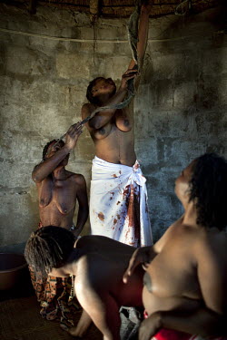 During their initiation to become sangomas, women chant and dance in their hut. They had 6 months of intense training - learning about traditional herbal medicine, divination, counselling and performi...