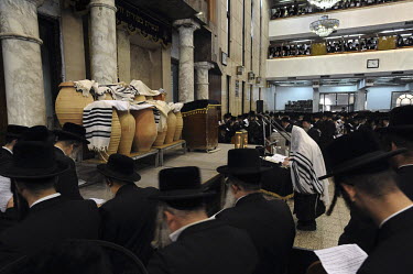 Ultra-orthodox Jewish men take part in a burial ceremony for Torah scrolls that were destroyed in a fire. Eleven Torah scrolls were burnt in a fire that broke out in a synagogue during the Jewish holi...