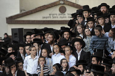 Ultra-orthodox Jewish children and young men take part in a burial ceremony for Torah scrolls that were destroyed in a fire. Eleven Torah scrolls were burnt in a fire that broke out in a synagogue dur...