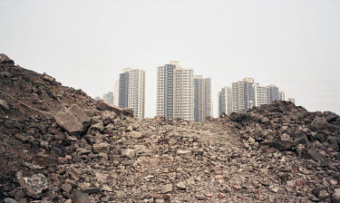 A construction site near new apartment blocks.