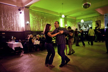 Couples on the dance floor at Claerchen's Ballhaus. This old East Berlin ballroom has long been popular among the local working class residents but is in an area now under threat of redevelopment by i...