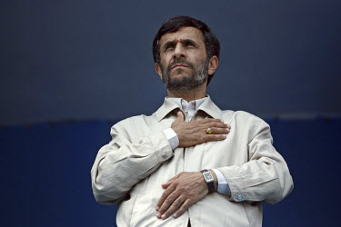 President Mahmoud Ahmadinejad presses his palm to his heart whilst he listens to the Iranian national anthem in the ethnically Turkish north-western Iranian town of Ardabil.