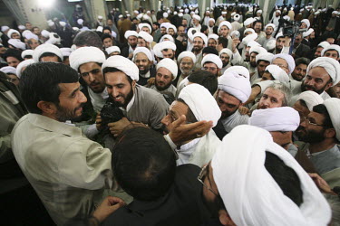 Iranian President Mahmoud Ahmadinejad greets religious figures after a meeting with them in Tehran. One of the principal parts of his provincial visits are gatherings with the local clergy, who are hi...