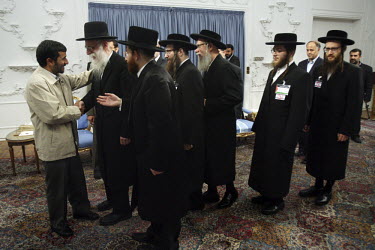 Iranian President Mahmoud Ahmadinejad shakes the hands of, and greets six rabbis from an anti-Zionist movement during a controversial Holocaust Conference in 2006.
