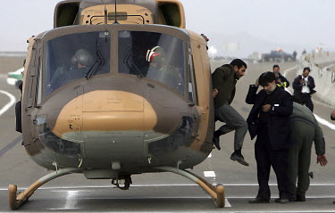 Iranian President Mahmoud Ahmadinejad jumps out of his helicopter during a provincial visit in Isfahan (Esfahan).