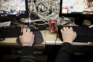 A Coca-Cola can next to young people playing on computers at Dreamhack, a digital festival with the largest LAN (local area network) in the world. 10,544 units were connected to the LAN, a world recor...