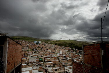 The slum that surrounds Bogota looks like a human anthill and it has little extra space for people who arrive in search of a place to build a hut. Between the densely built-up hillsides lies a ridge w...