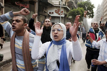 Protesters march through the streets of central Cairo. 25 January 2011 saw the beginning of a non-violent 18 day protest movement that eventually ended the 30-year rule of Hosni Mubarak and his Nation...