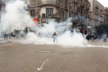 Protesters march through the streets of central Cairo amidst tear gas fired by the police. 25 January 2011 saw the beginning of a non-violent 18 day protest movement that eventually ended the 30-year...