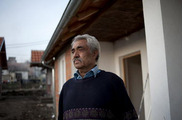 Sadik Shabani stands outside of a newly constructed house by the UNHCR. He was returned from Macedonia to Kosovo on the 4th December 2009.
