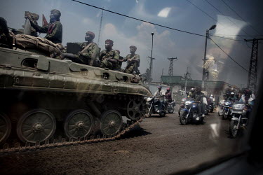 The Congolese Army leave Goma on a tank and motorcycles on their way to the frontline to fight the rebel troops of General Nkunda.