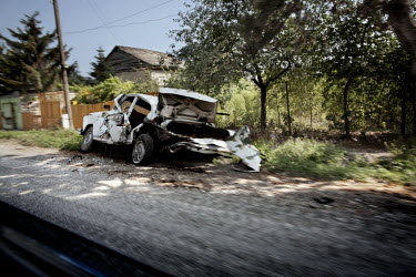 A burnt out car in the village of Tkviavi, between the South Ossetia border and Gori. After the Russian Army invaded the area, most of the inhabitants fled the village.