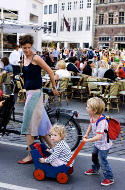 A mother with her children in front of the Cafe Europa in Copenhagen.