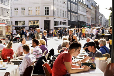 People sit outside at an open air cafe in Amagertorv, Central Copenhagen.