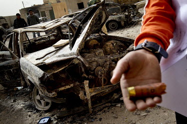 Cars that were being held in police custody destroyed during the attack on the police station. A boy shows used rounds of ammunition. On 17 February the country saw the beginnings of a revolution agai...