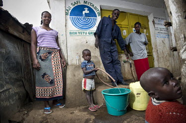 Residents of Kibera, Nairobi's biggest slum, queue at a water standpipe to buy their daily supplies.