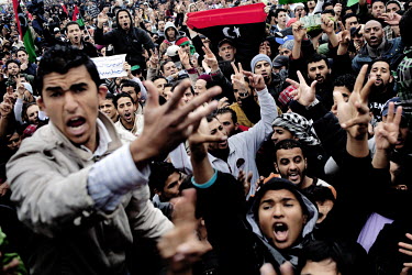 Crowds at a Friday prayer and protest against the Gaddafi regime in central Benghazi. Benghazi is now in the hands of the rebels. On 17 February 2011 Libya saw the beginnings of a revolution against t...