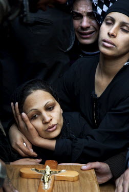 Family members mourning at the funeral of a Christian man shot dead by Egyptian soldiers during clashes between Muslims and Christians in Cairo's Moqattam quarter. Clashes broke out between Coptic Chr...