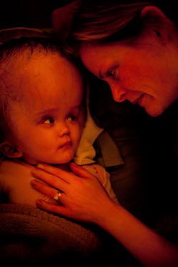 Cecilie lies with Victoria at Annapurna Neurological Institute in Kathmandu. 19 month old Victoria (formerly named Ghane) was born with hydrocephalus and was left abandoned. Cecilie Hansen was so move...