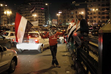 Men selling flags in Tahrir Square. Tahrir Square was the scene of weeks of protests against the regime of Hosni Mubarak. He eventually resigned on 12 February 2011.