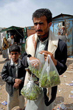 A man sells qat on a street.