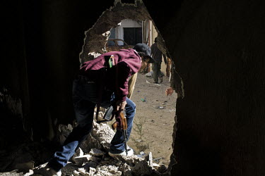 Ahmed, a rebel fighter moves from house to house in the back streets of Misurata to take up positions to fire on Gaddafi forces. On 17 February 2011 Libya saw the beginnings of a revolution against th...