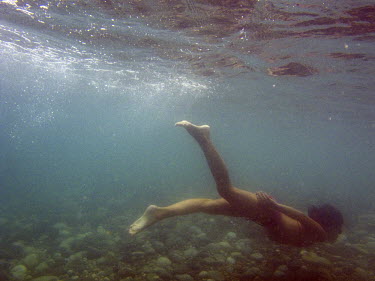 A woman swims underwater in the Black Sea.