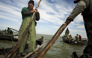 Fishermen on Lake Razim work together to make their catch. Most of local fishermen are Lipovani, descendants of migrants who left Russia in the 18th Century to avoid religious persecution.