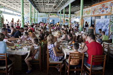 Tourists eat lunch in a canteen in Zatoka, a cheap Black Sea resort destination in Ukraine popular with Moldovians.
