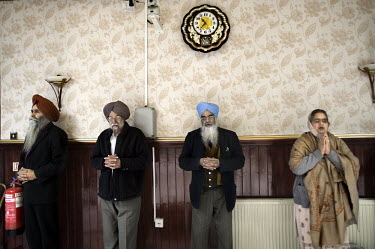 Sikhs pray at the Guru Nanak Gurdwara temple in Leicester.
