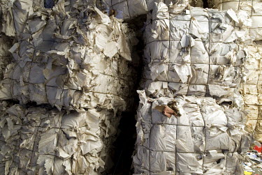 Pressed and bound bales of paper is stacked prior to being recycled the Voutselas recycling plant in Renti, an industrial district of the city.
