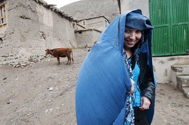 Souhaila, a graduate of the Taloqan CME (continuing medical education) Midwife Training School, makes her way home at the end of her working day. Afghanistan has one of the highest fertility rates in...
