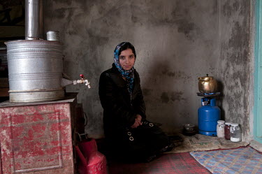 Souhaila, a graduate of the Taloqan CME (continuing medical education) Midwife Training School, at her home at the end of her working day. Afghanistan has one of the highest fertility rates in the wor...