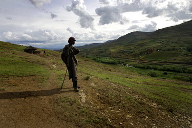 A man stands on a hill near Letseng diamond mine.