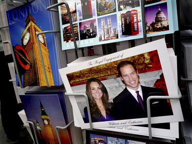 A postcard depicting royal wedding couple Prince William and Kate Middleton for sale in a souvenir shop on Oxford Street, London.