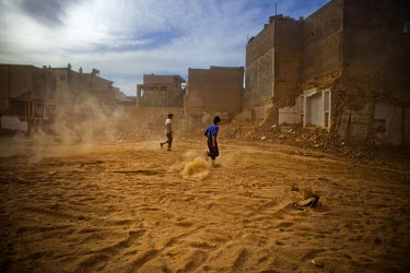 Children play at demolition site in the old city in Kashgar. The old city, where Uighur (Uyghur) people have lived and worked for centuries, is being demolished for reconstruction under the government...
