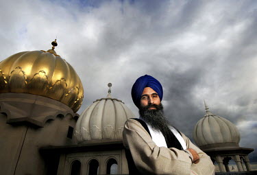 Giani Balwinder Singh, Priest (Sikh), poses in front of Gurwara Sri Guru Singh Sabha Temple in Southall, London.