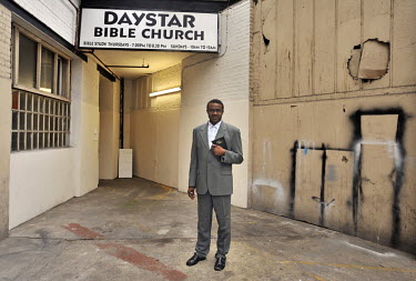 Pastor Bode Fadojtimi poses at Daystar Pentecostal Bible Church in Dalston, London.