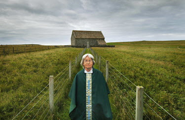 The Reverend Barbara Morrison poses in front of St. Moluag's Episcopal Church on the Isle of Lewis.
