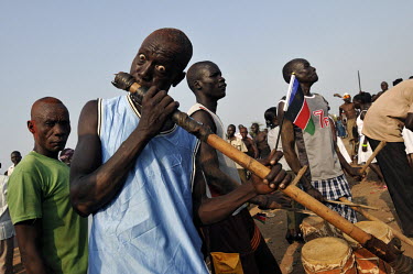 Musicians with traditional instruments play music near the tomb of John Garang, former rebel leader and head of the Sudan Peoples Liberation Army (SPLA) during independence celebrations in the capital...