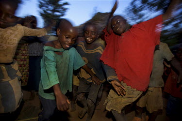 Children dance in Ruzo Cell, Gaharwa Lake, Bugesera District, Rwanda, during the Mother and Child Health Week held in April 2010. This includes a mass drug administration against intestinal worms and...