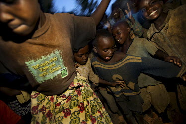 Children dance in Ruzo Cell, Gaharwa Lake, Bugesera District, Rwanda, during the Mother and Child Health Week held in April 2010. This includes a mass drug administration against intestinal worms and...
