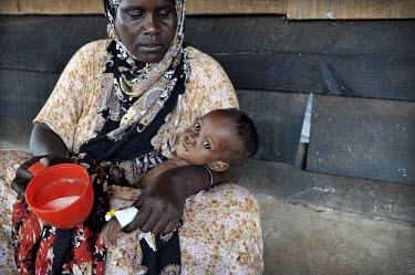 A mother holds her malnourished baby in the stabilisation ward at a hospital at Dadaab refugee camp. Since Al Shabaab, an Islamic militia with alleged links to Al Qaida, is controlling large parts of...