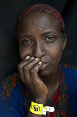 A portrait of 23 year old Rahmo Ibrahim Abdi at the Dadaab refugee camp. She is from Dinsor in Somalia and did not want to leave, even though most of her neighbours had. She continued to stay with her...