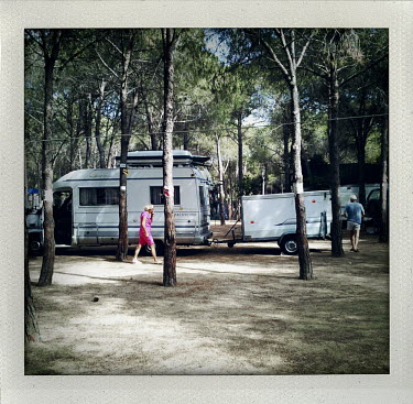 A couple with a camper van and trailer search for a spot at Spiaggia del Riso, Campu Lungu.