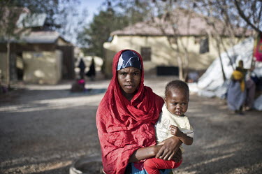 18 year old Faduulo Hassan Ismail with one of her three children inside the compound of Galcayo's hospital. She came from near Mogadishu to escape fighting after two of her brothers were killed by Al-...