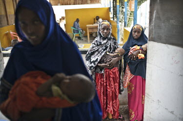 Women waiting at Galcayo's hospital for treatment for their malnourished children. Galcayo is a town in the self-declared autonomous state of Puntland. The populace in the region suffers from a litany...