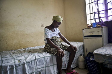 19 year old Fatuma is pregnant and sits on a bed at a health centre in the village of Waterloo. A year ago Sierra Leone launched a free healthcare plan for pregnant women, breast-feeding mothers and c...